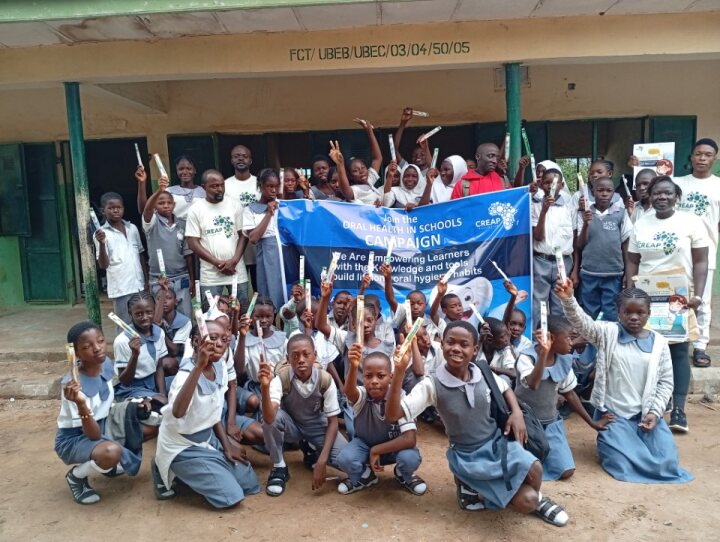 Pupils celebrate their new toothbrushes at the campaign send-off