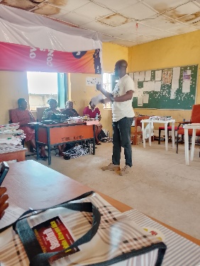Facilitators review outreach materials ahead of the school session
