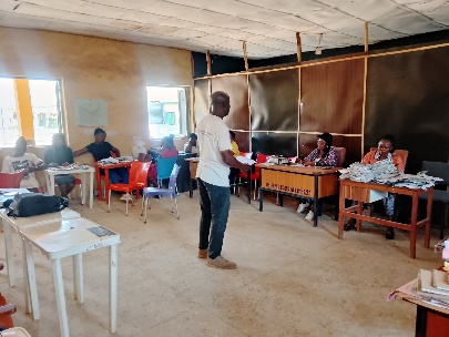 A pre-outreach briefing session at the school