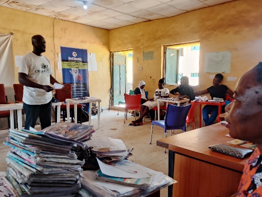 Facilitators brief the class using the campaign's roll-up banner