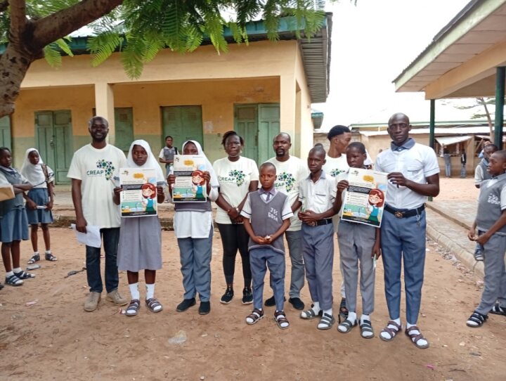 Pupils and teachers display their oral hygiene flyers