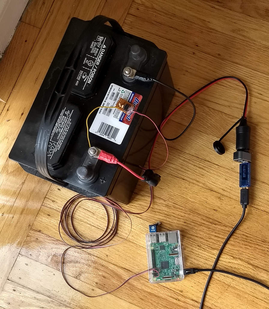 Battery power setup with a large battery, USB power to a Raspberry Pi, and sensor hardware.