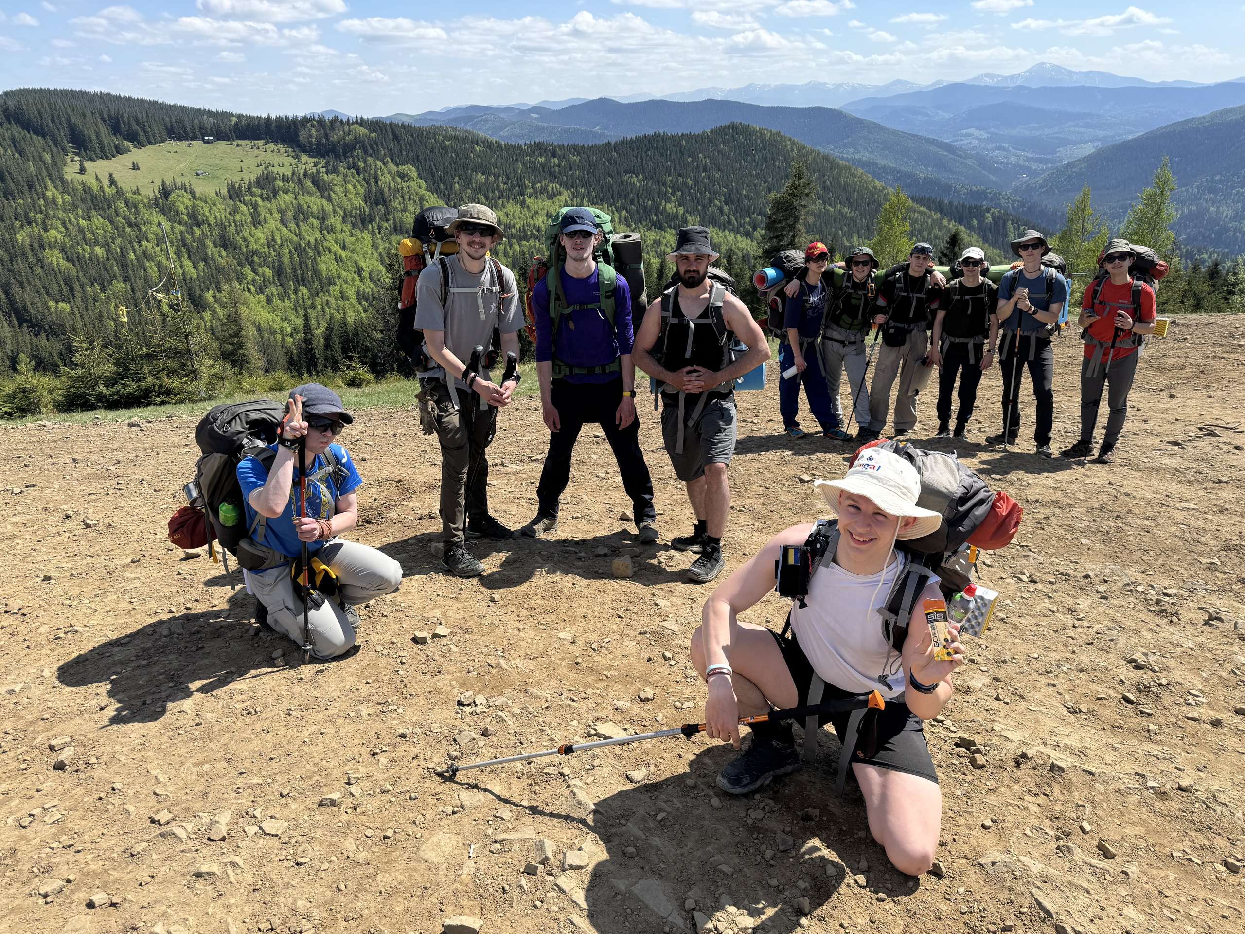 Our team of 12 guys at a mountain summit