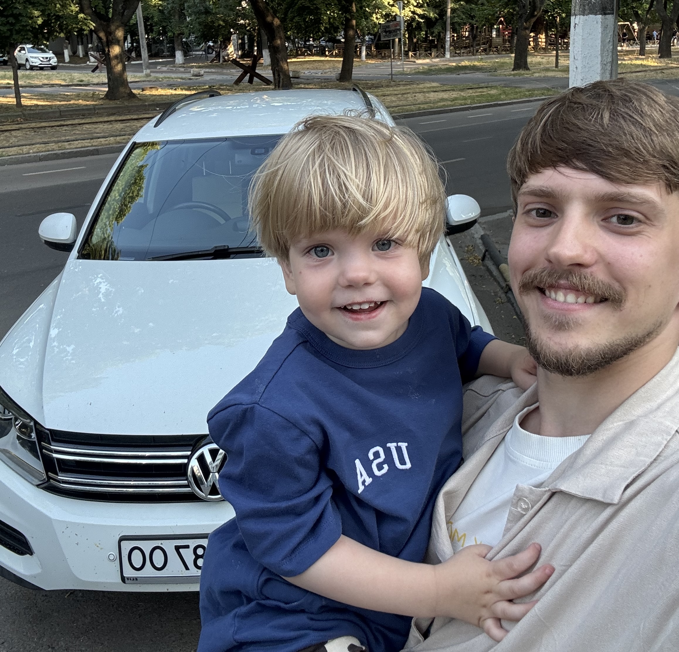 Kostia and Nazar with the ministry car