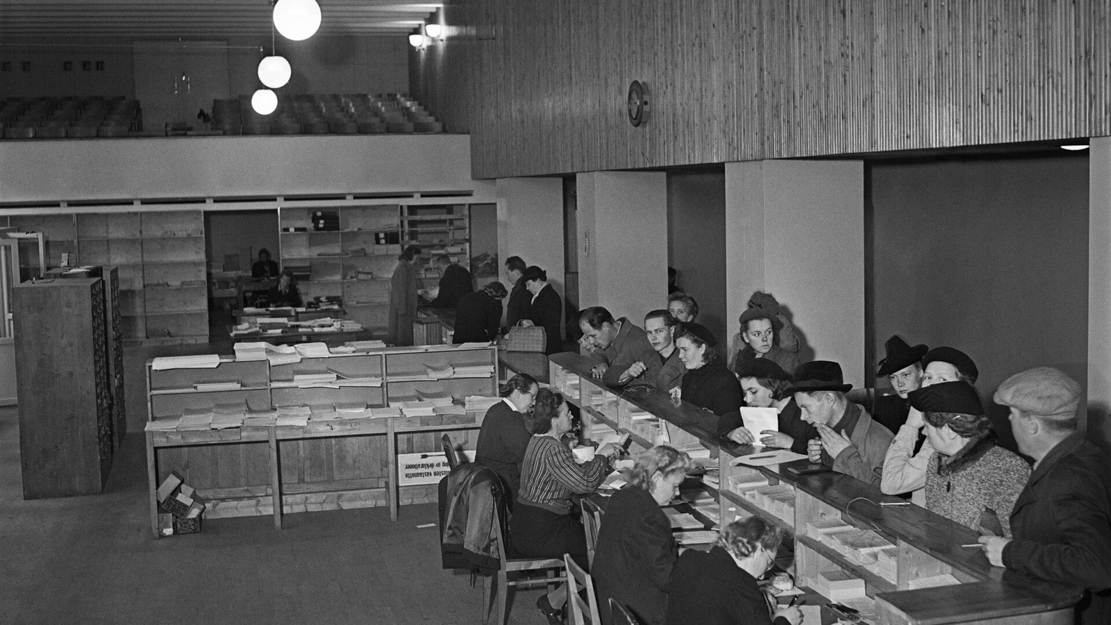 Illustrative photograph titled: People at Tax Office 1945 (8335C; JOKAHBL3C F10-1)