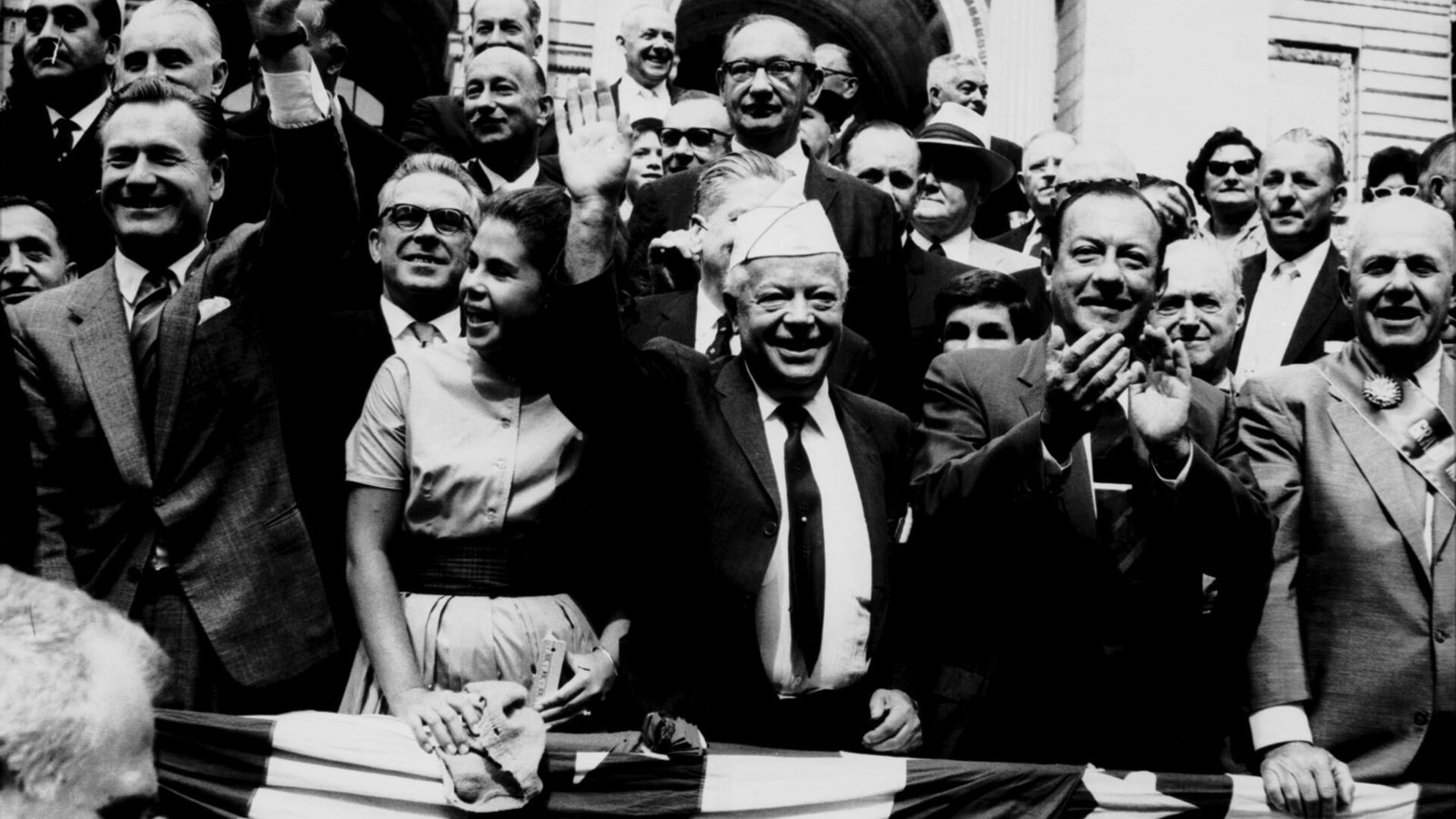Illustrative photograph titled: Nelson Rockefeller, Dubinsky's granddaughter Ryna Appleton, David Dubinsky, Robert Wagner, and George Meany wave to the public at a Labor Day parade. (5278801035)