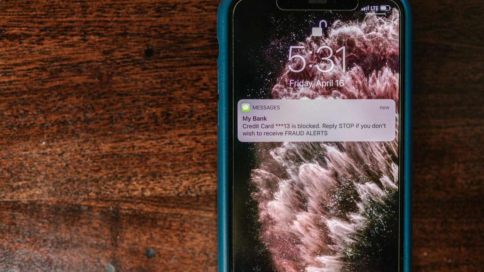 Smartphone displaying a fraud alert notification