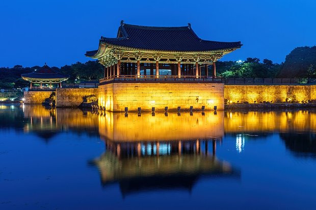 Donggung Palace pavilions reflected in Wolji Pond (동궁과 월지) at blue hour