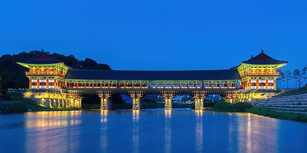 Woljeonggyo Bridge (월정교) lit up at blue hour over the Namcheon stream