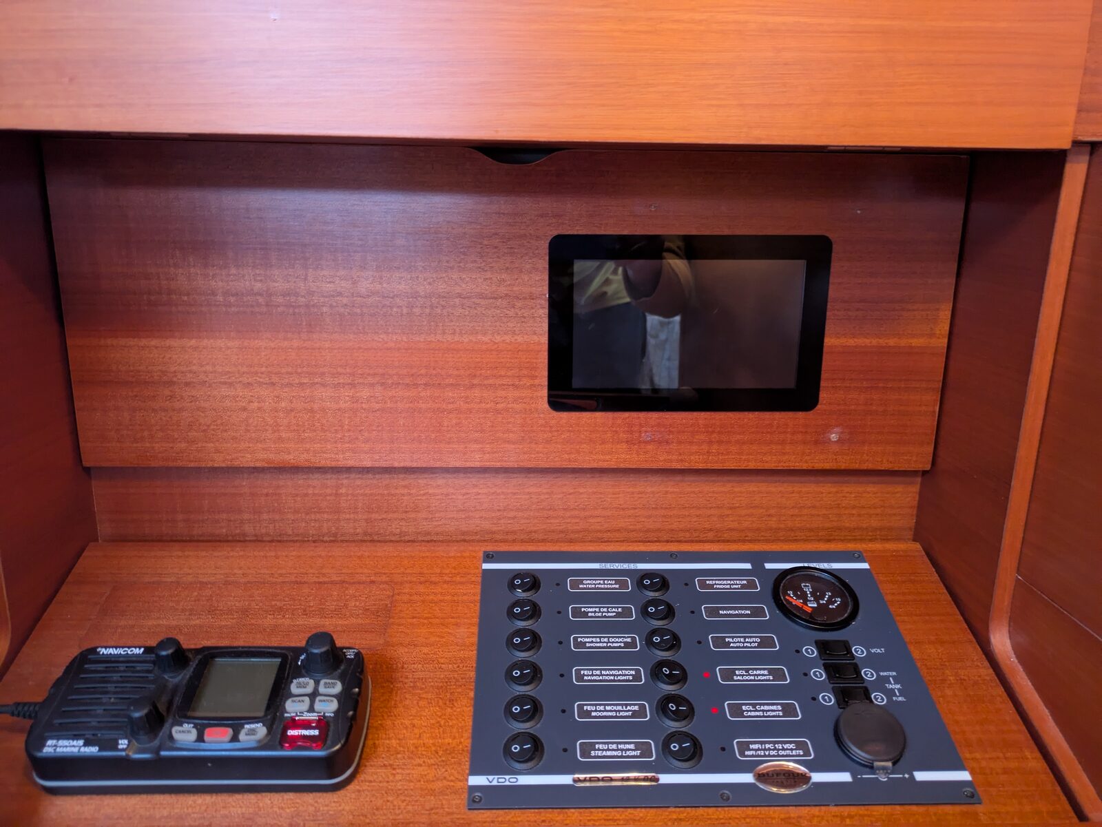 The touchscreen set into the panel above the switchboard and the VHF