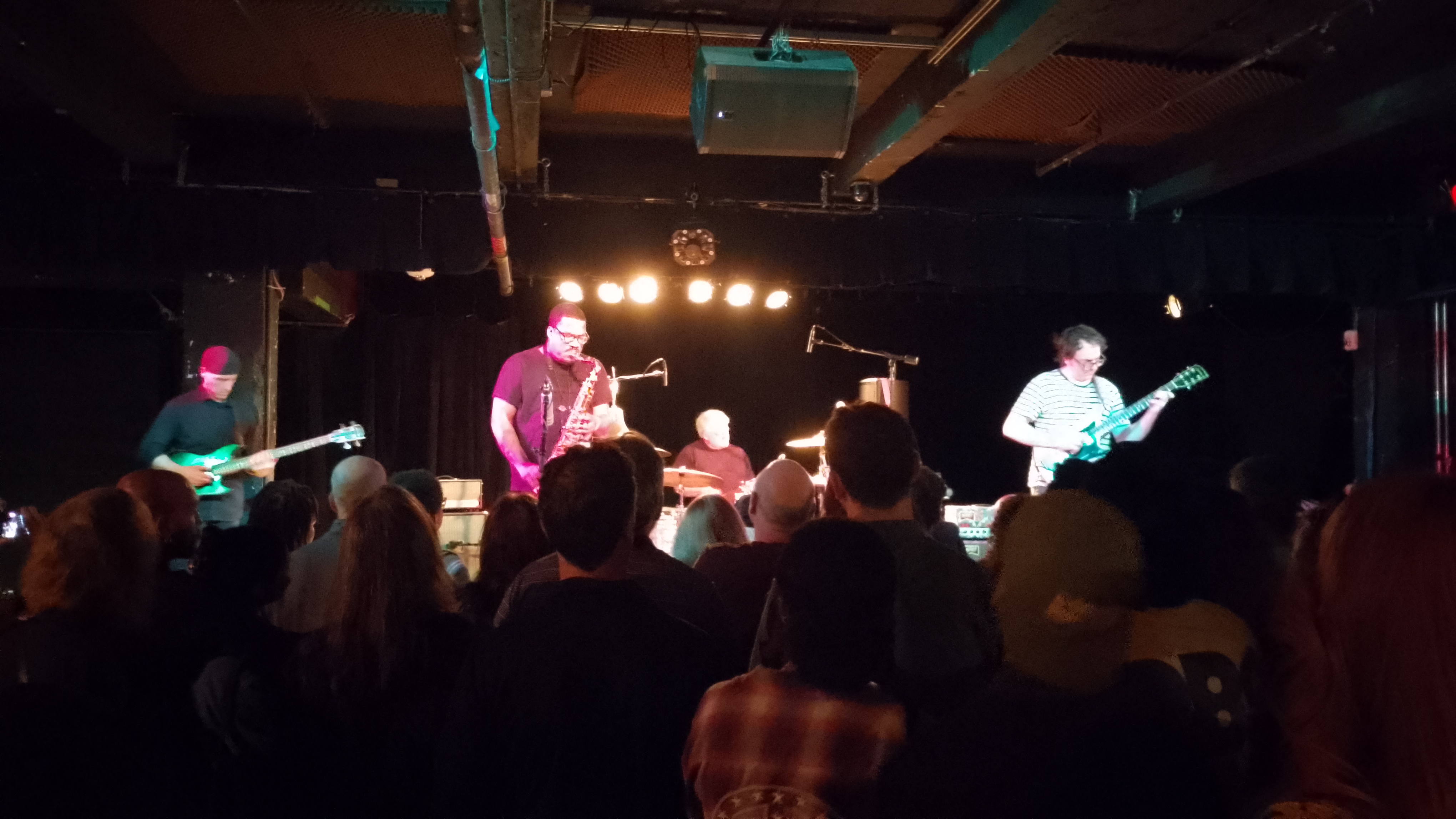 The Messthetics perform under the lights of The Black Cat