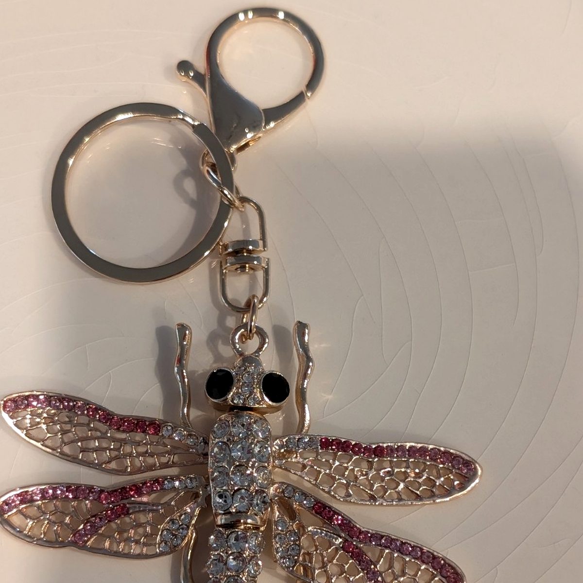 Pink rhinestone dragonfly reminder charm with gold-tone keyring and clasp