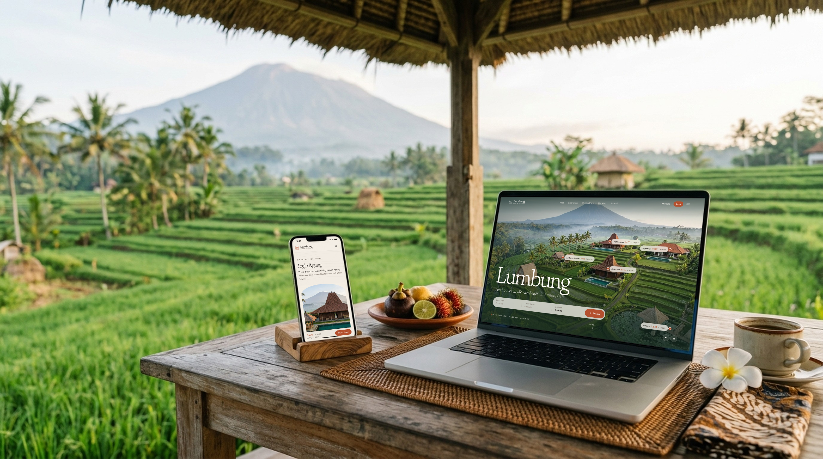 Bali Villa Rentals website template on a laptop and a phone on a villa terrace above the rice fields