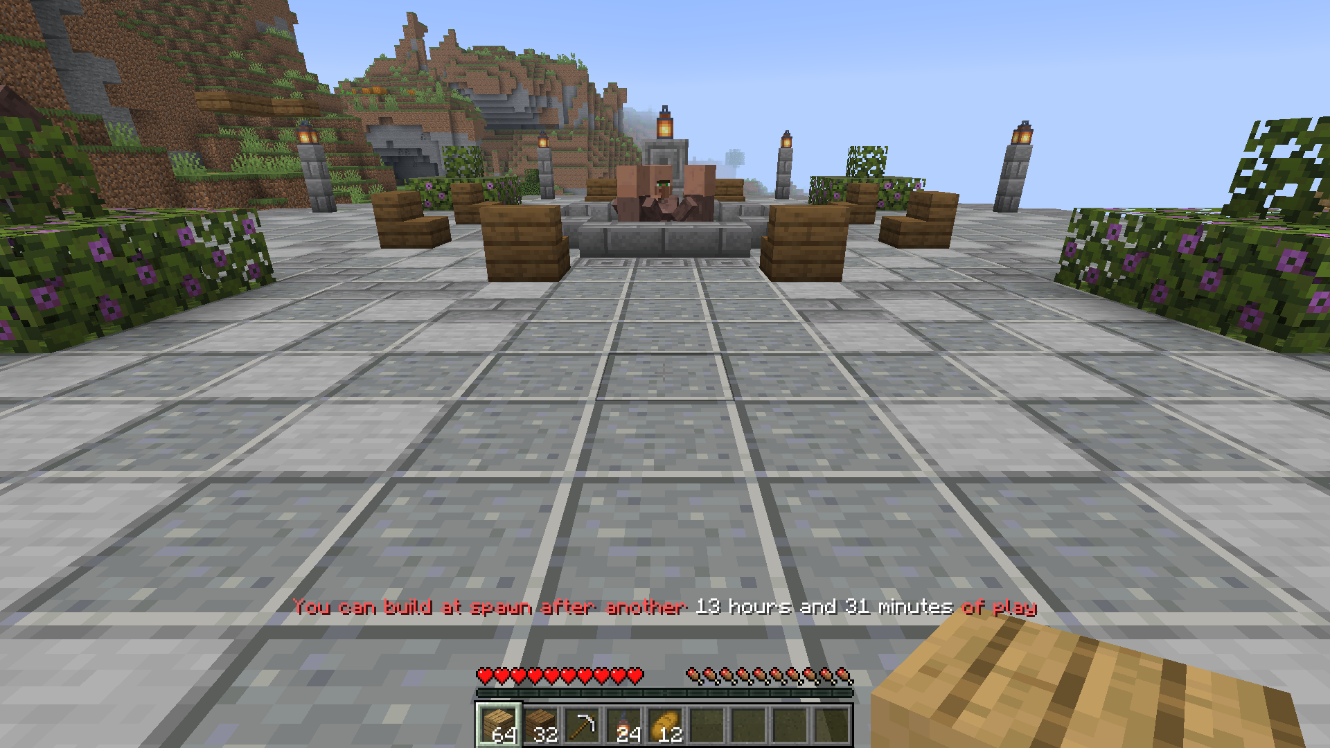A new player trying to build at spawn is told how much longer they need to play