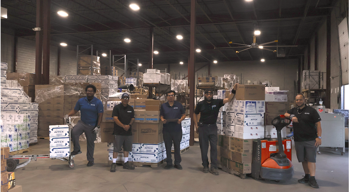 Action team working together in a facility supply warehouse