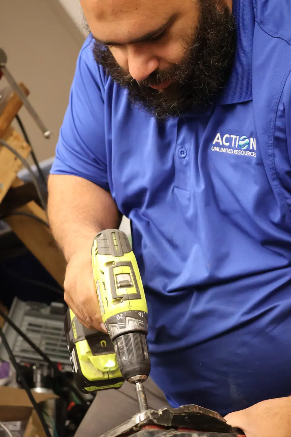 Richie, an Action repair technician, working on commercial cleaning equipment