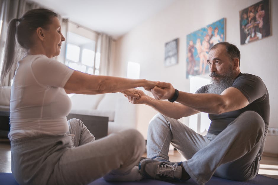Elderly couple practicing yoga together on mats in a cozy living room setting.