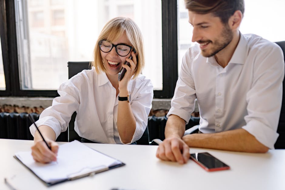 Business professionals discussing ideas in a modern office setting.