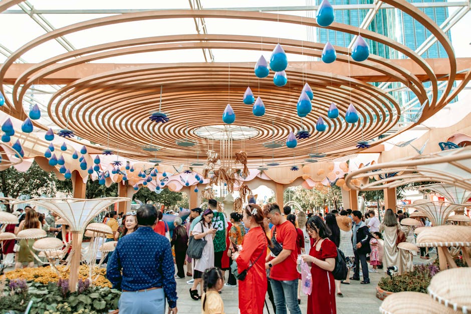 Colorful outdoor festival with intricate wooden ceiling design and bright blue raindrops.
