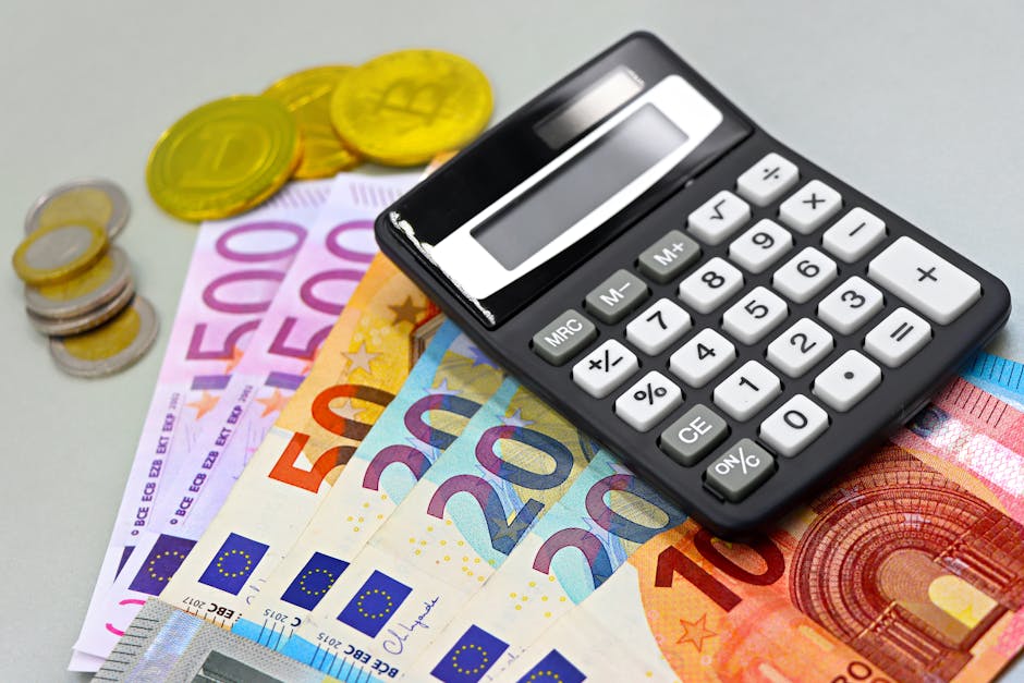 Image of euro banknotes, coins, and a calculator for financial planning. Perfect for finance themes.