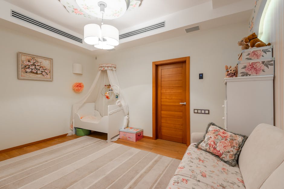 A serene baby nursery featuring a crib, floral accents, and a wooden door for a warm interior.