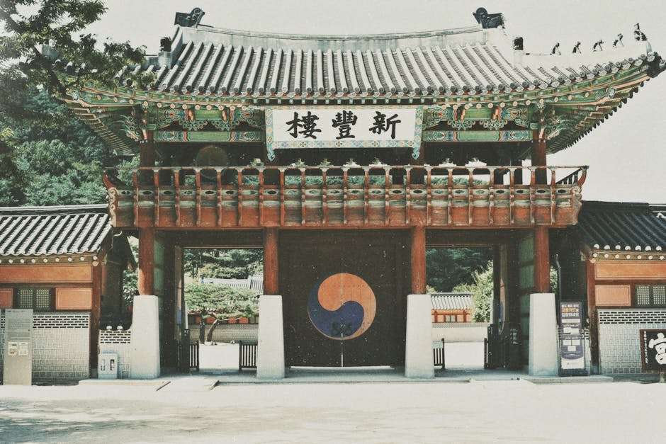 Beautiful historic temple gate in Korea with traditional architecture and vibrant colors.