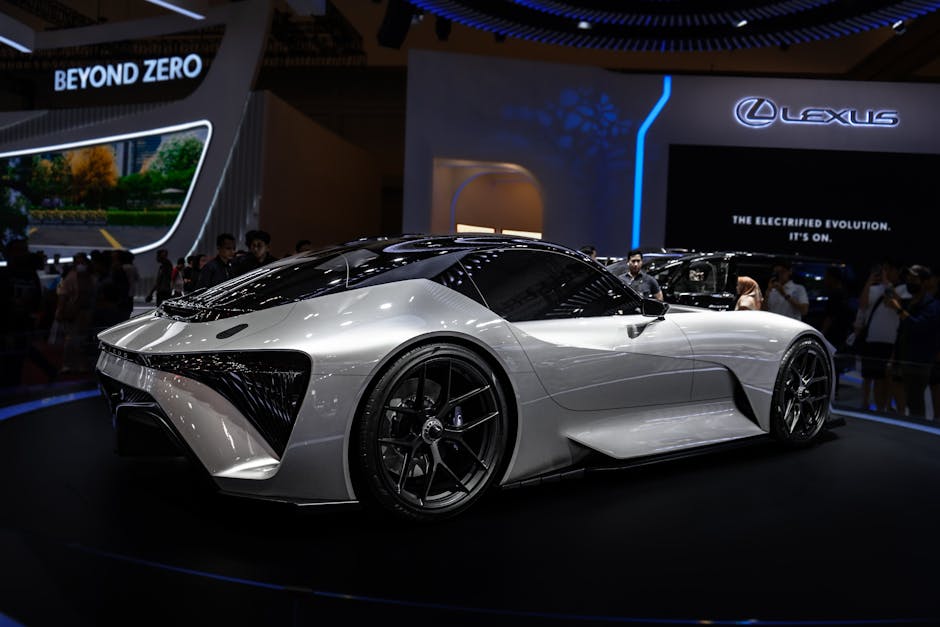 Modern electric sports car displayed at international auto show. Sleek design and futuristic features.