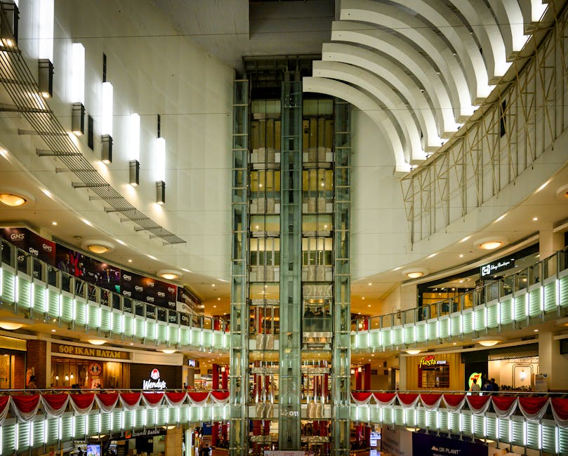 Modern architectural design of a mall interior in Jakarta, showcasing bright lighting and multiple floors.