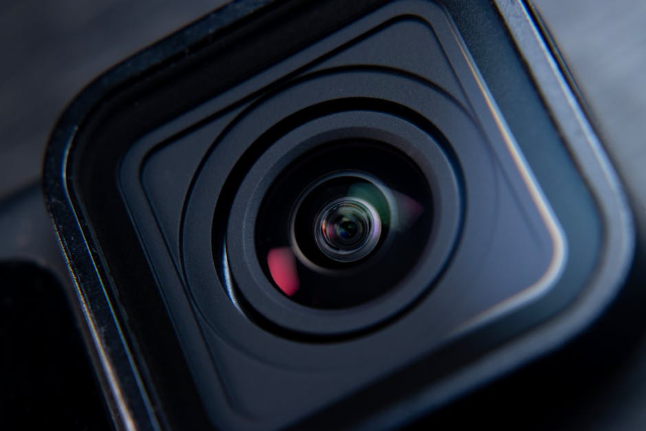 Detailed shot of a camera lens focusing on lens structure and reflections.
