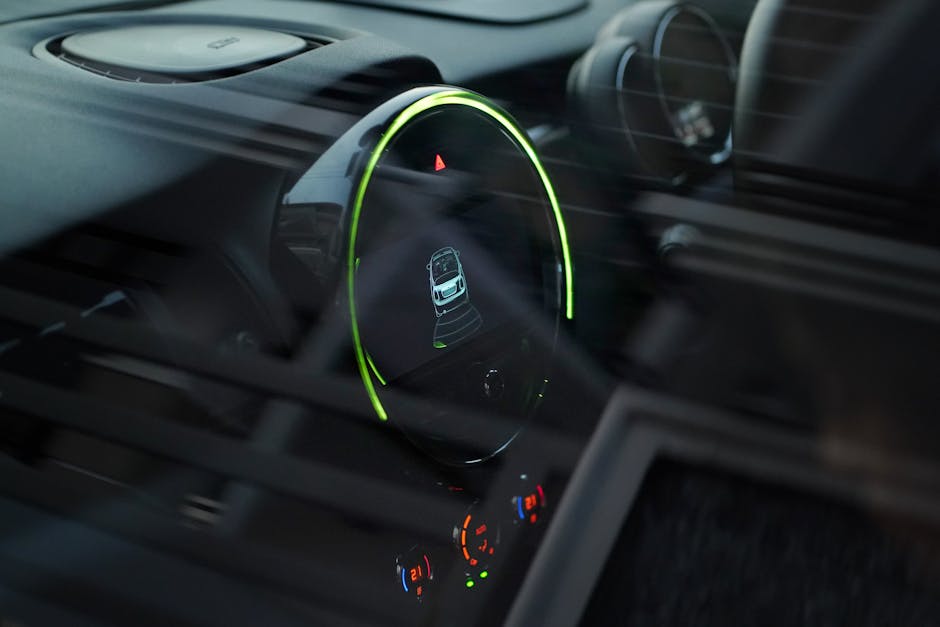 Close-up of a futuristic car dashboard in selective focus, emphasizing modern design elements.