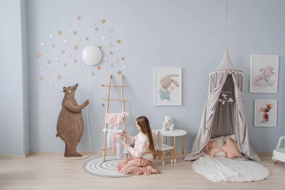 Woman arranging baby clothes in a beautifully decorated nursery with playful decor.