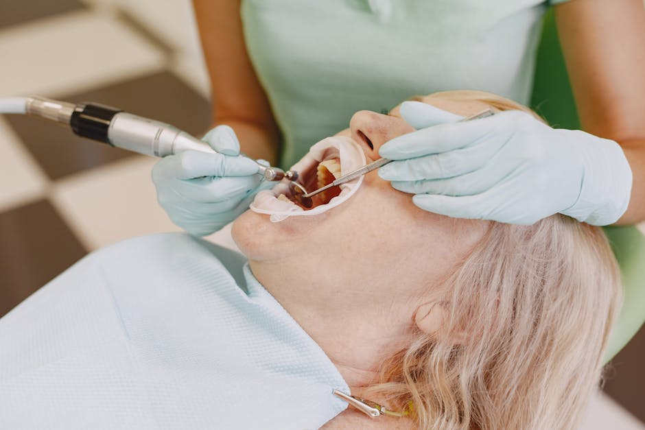 Close-up of a dentist performing a dental procedure on a patient in a clinic.
