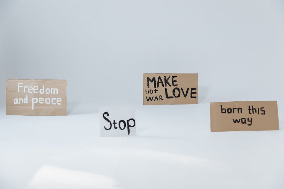 Cardboard signs promoting peace, love, and acceptance, perfect for activism and social movements.