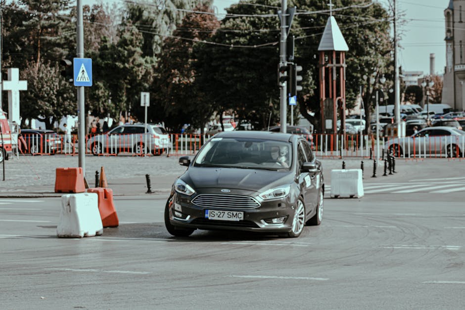 Rally racing car driving fast while turning on asphalt roadway in modern city