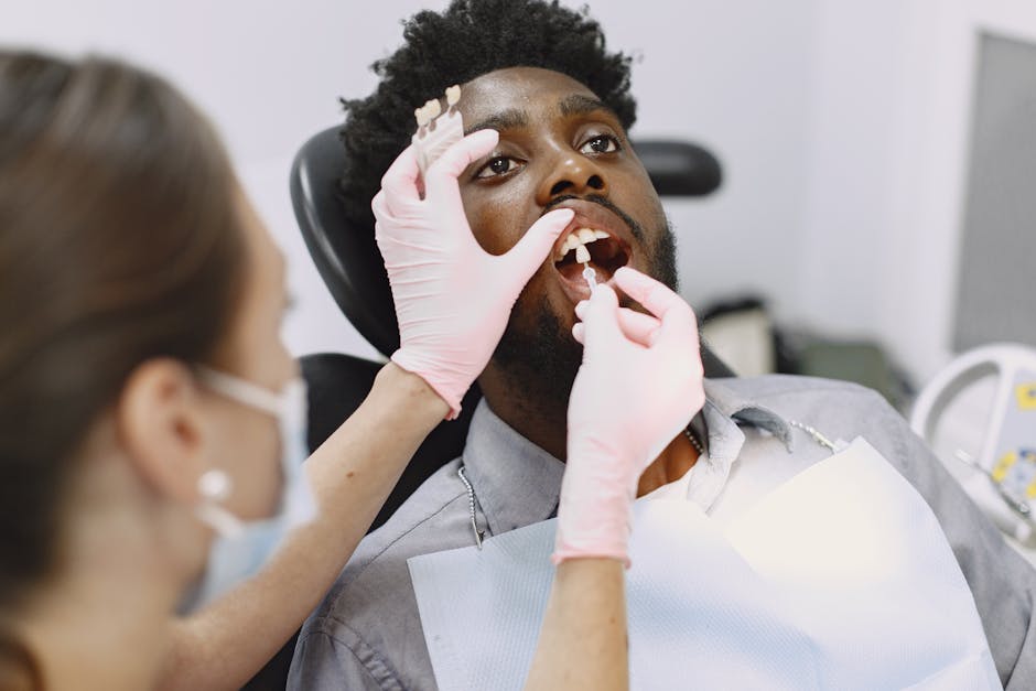 A patient receiving dental care during a checkup in a clinic.