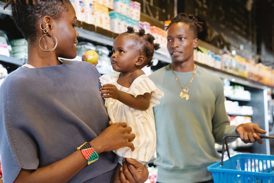 Family with child shopping at a grocery store, interacting and holding a product.