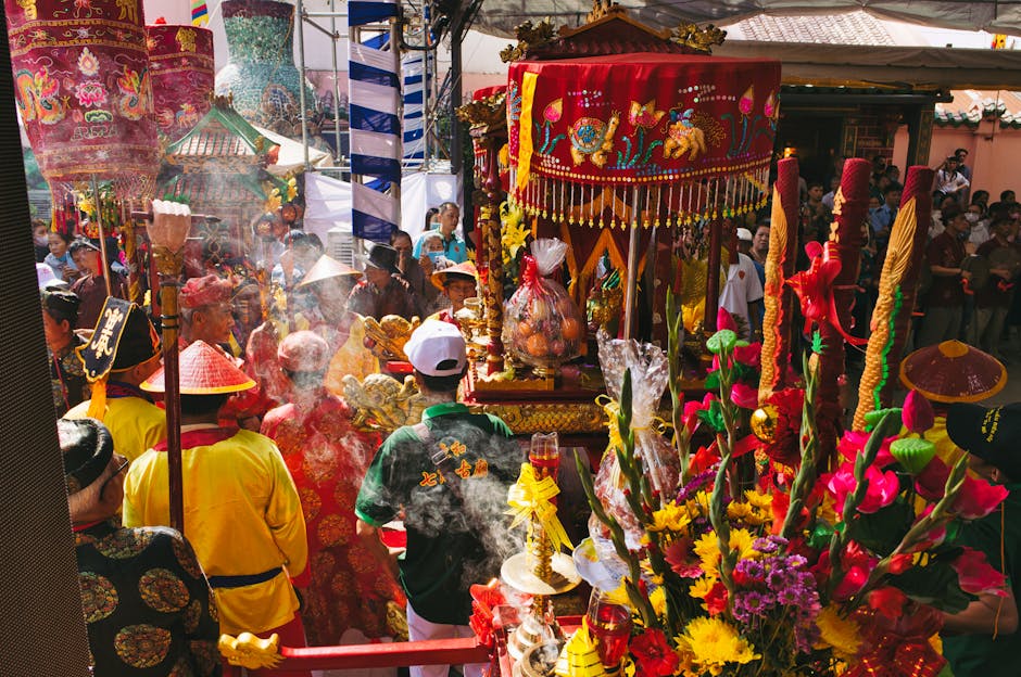 Colorful and vibrant Asian festival with traditional clothing, decorations, and a lively crowd.