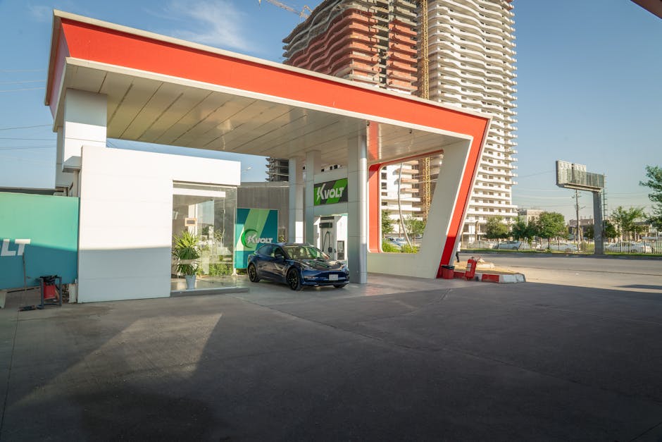 Electric vehicle at a modern charging station in an urban setting, promoting sustainability.