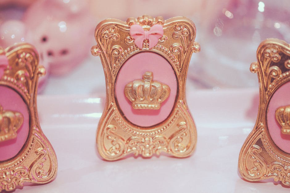 Close-up view of a decorative pink and gold crown ornament, perfect for princess-themed decor.