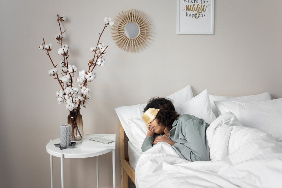 A peaceful bedroom scene with a woman sleeping, enhancing calm and relaxation.