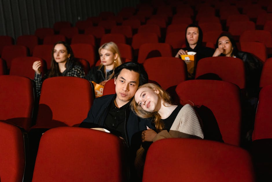 Multiple couples enjoying a movie in a cozy cinema setting, perfect for entertainment themes.