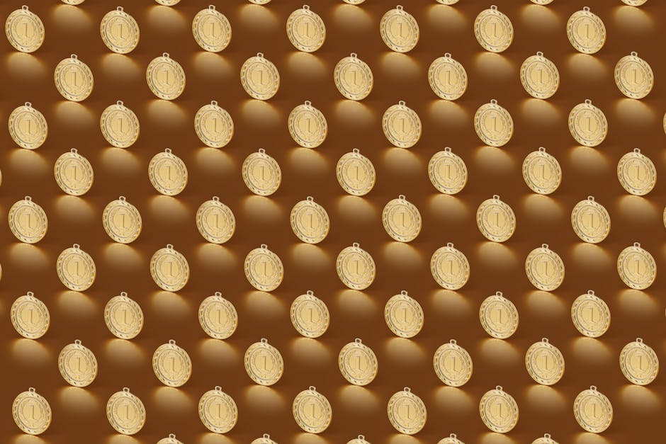 Multiple gold medals arranged in a repeating pattern on a brown backdrop.