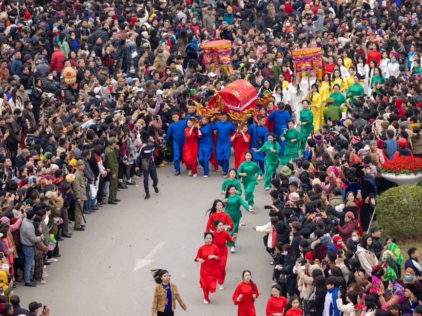 A lively procession during the Ky Cung Ta Phu Temple Festival in Lạng Sơn, Vietnam, showcasing colorful costumes and cultural traditions.