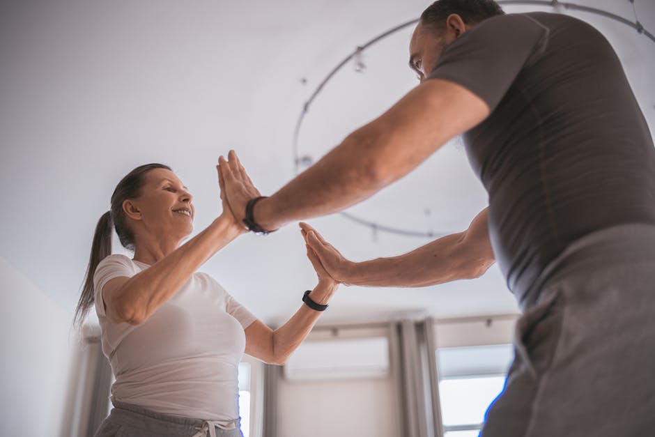 A senior couple joyfully exercising indoors, emphasizing health and togetherness.