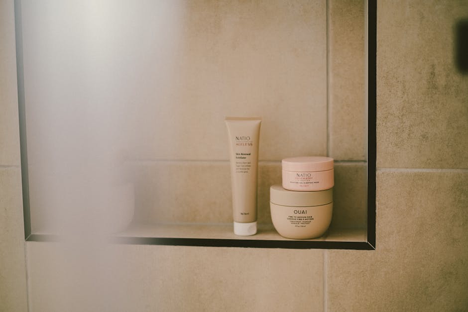 A modern bathroom shelf featuring beauty and self-care products in a minimalist style, perfect for self-care routines.