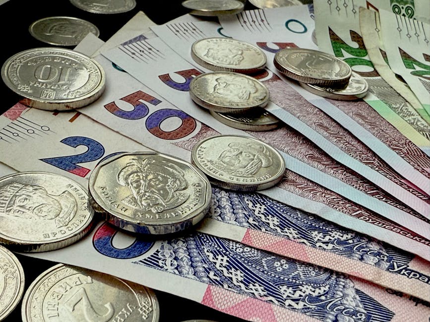 Close-up of various coins and banknotes from different countries, showcasing diversity in currency.