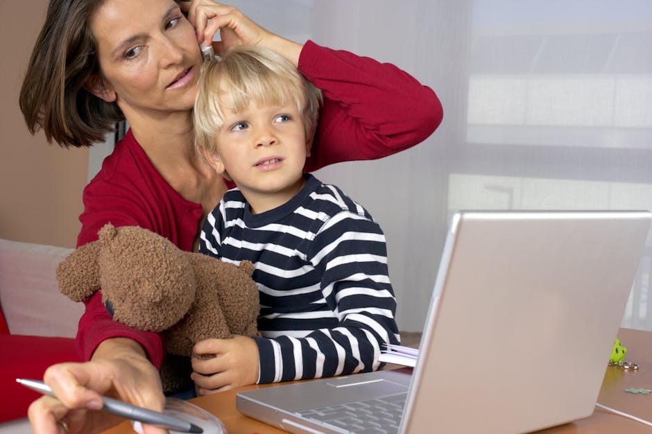 A mother multitasks by talking on the phone while managing work and child at home.