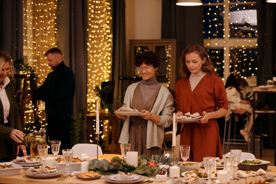 Warm Christmas gathering with family and friends around a festively decorated dining table.
