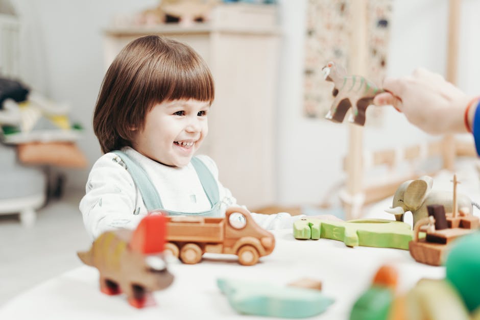 A joyful child plays with wooden toys, showcasing creativity and happiness indoors.