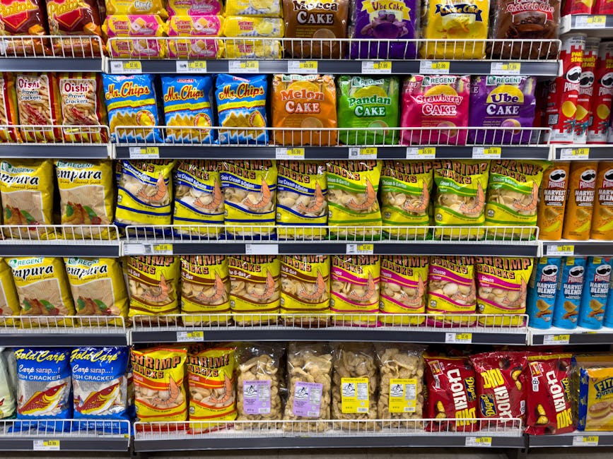 Colorful snack packages neatly displayed in a supermarket aisle showcasing Asian food variety.